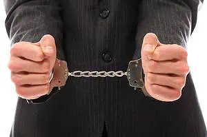 hands of young man in handcuffs